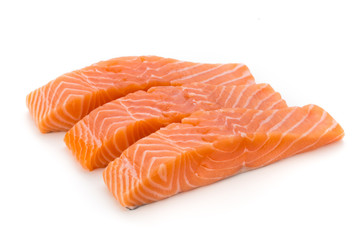 Fresh salmon fillet with basil on the white background. © gitusik