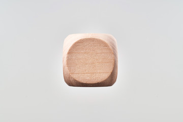 Abstract floating wooden dice on white background