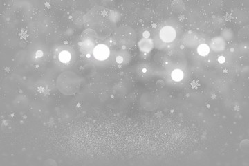 nice glossy glitter lights defocused bokeh abstract background with falling snow flakes fly, festival mockup texture with blank space for your content