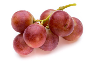 Ripe red grape isolated on white.