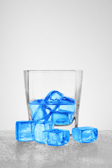 a glass of water with ice cubes