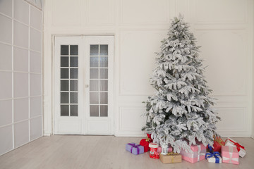 White room Christmas tree with red toys new year winter gifts decor