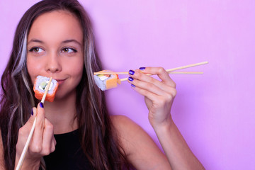 beautiful woman with sushi and chopsticks isolated