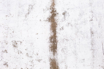 brick plastered wall with whitewash with potholes, cracks and stains, shot on a cloudy autumn day