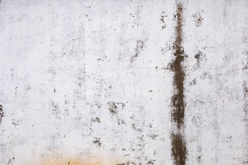 brick plastered wall with whitewash with potholes, cracks and stains, shot on a cloudy autumn day