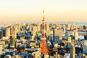 tokyo tower and city skyline under sunset