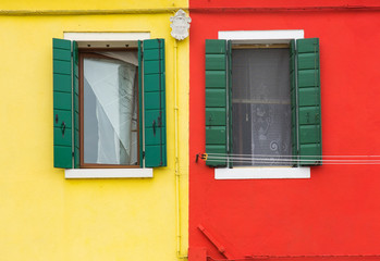 Venice, Burano, colorful walls of houses and two windows