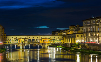 Fototapeta na wymiar View of Gold (Ponte Vecchio) Bridge in Florence on a sunset