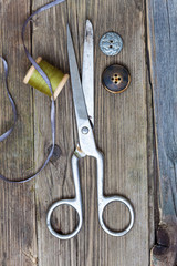 vintage dressmaker scissors, bobbin of thread and buttons