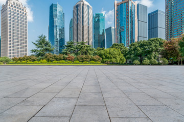 Blue sky, empty marble floor and skyline of Shanghai urban architecture.