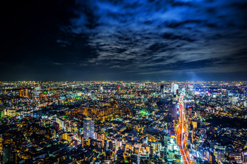 tokyo tower and city skyline under blue night