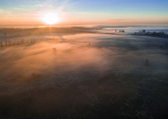 Fototapeta na wymiar mystical foggy dawn. space atmosphere. COld autumn valley mood