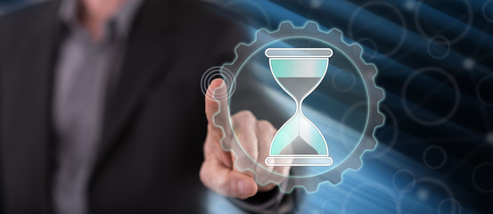 Man touching a time management concept
