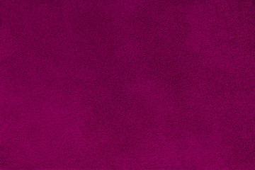 Dark purple matt suede fabric closeup. Velvet texture.