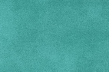 turquoise matt suede fabric closeup. Velvet texture.