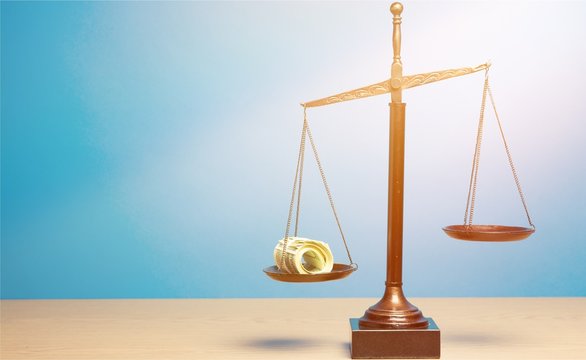 Justice Scales with money on table. Justice concept