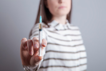 girl addict with a syringe