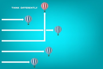 Think different. Think differently concept. Red balloon changing direction. New idea, change, trend, courage, creative solution, innovation and unique way concept.