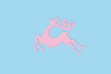 Pink Reindeer on blue background with copy space, New year, Christmas Concept