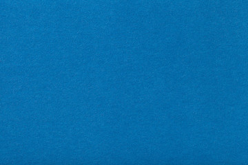 Fototapeta na wymiar Light blue matt suede fabric closeup. Velvet texture of felt.