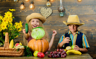 Children play vegetables pumpkin cabbage. Kids girl boy wear hat celebrate harvest festival rustic style. Celebrate harvest holiday. Elementary school fall festival idea. Autumn harvest festival