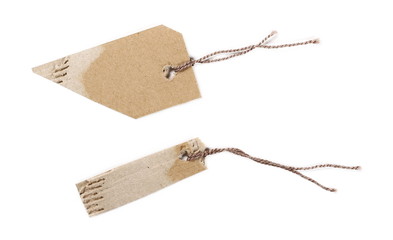 Blank cardboard price tags tied with string isolated on white background, top view