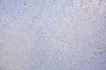 White stain texture  on black plastic background