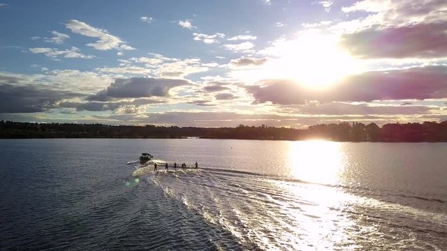 Discing behind boat, watersports 5 people