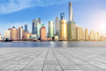 Blue sky, empty marble floor and skyline of Shanghai urban architecture.