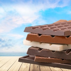 Delicious chocolates isolated on  background