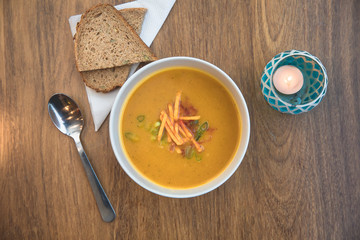 Aerial view above a bowl of healthy pumkin soup