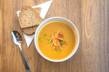 Aerial view above a bowl of healthy pumkin soup