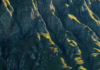 Texture of sidelight on rock face of the Alvier, Swiss Alps