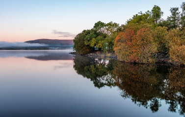 Mist and autumn colour at Milarrochy Bay on Loch Lomond