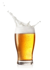 Splash of foam in glass of beer - 232277522