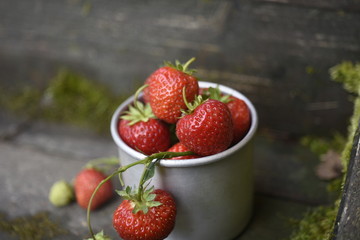 strawberries in a metal mug