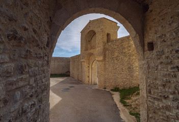 Fototapeta na wymiar Arch and entrance to old medieval fortress (Rocca Albornoziana) in Spoleto, Umbria, Italy