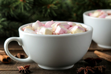 hot cocoa with marshmallows in a cup on a brown wooden background. Winter. new Year. Christmas