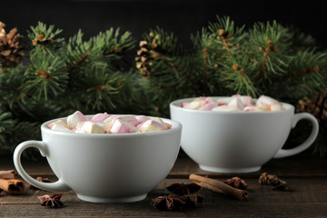 Obraz na płótnie Canvas hot cocoa with marshmallows in a cup on a brown wooden background. Winter. new Year. Christmas