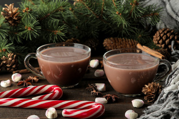 hot cocoa in a glass cup on a brown wooden background. Winter. new Year. Christmas. tree gifts