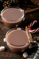 hot cocoa in a glass cup on a brown wooden background. Winter. new Year. Christmas. tree gifts
