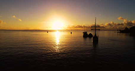 Fototapeta na wymiar boat with Sunset in aerial view , french polynesia