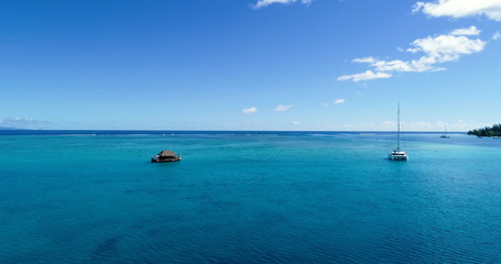Naklejka na ściany i meble boat bungalow (house) on a lagoon in aerial view, French Polynesia
