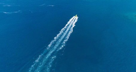 boat in a lagoon in French Polynesia, in aerial view