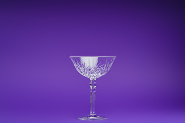 close-up view of single empty glass on purple background