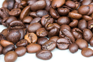 Roasted coffee beans isolated on a white background.