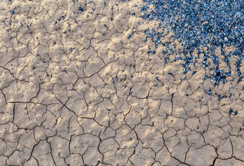 Cracks in the clay as a background top view