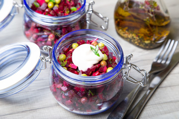 Vinaigrette salad with mayonnaise in a jar. Selective focus, close-up.