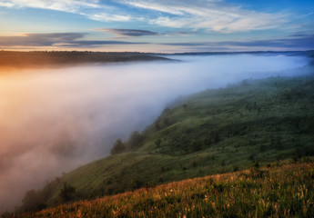 fog in the canyon of a picturesque river. spring morning