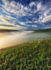 fog in the canyon of a picturesque river. spring morning